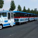 3 cabins fiberglass material trackless electric train ride running on road
